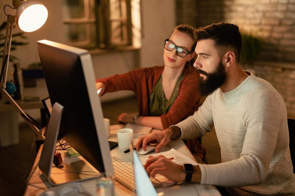 young business colleagues using computer while working together office 637285 2676